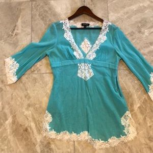 Turquoise Bebe tunic with sexy lace detail.